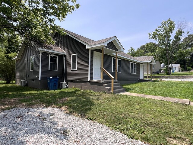 119 Maple Ave, Camden, TN 38320 - view of front of property featuring a shingled roof, a front yard, crawl space, and entry steps