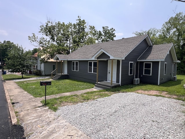 119 Maple Ave, Camden, TN 38320 - ranch-style home featuring a shingled roof and a front lawn