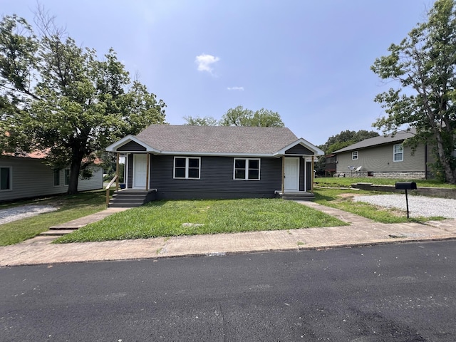 119 Maple Ave, Camden, TN 38320 - view of front of property featuring a front lawn and a shingled roof