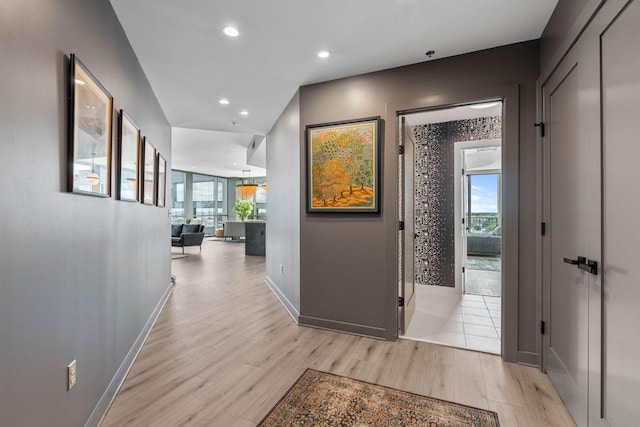 900 20th Ave S Unit 1601, Nashville, TN 37212 - hallway featuring light wood-type flooring, recessed lighting, and baseboards