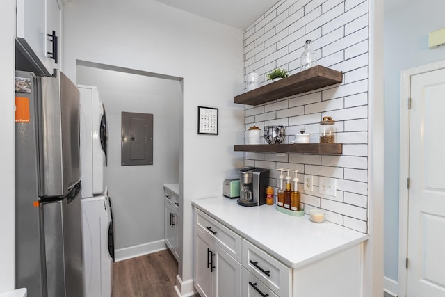 7234 Althorp Way Unit U8, Nashville, TN 37211 - kitchen with electric panel, stacked washer and clothes dryer, backsplash, open shelves, and dark wood-style flooring