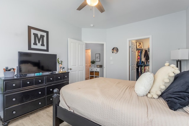 7234 Althorp Way Unit U8, Nashville, TN 37211 - bedroom featuring light wood-type flooring, a walk in closet, a closet, and a ceiling fan