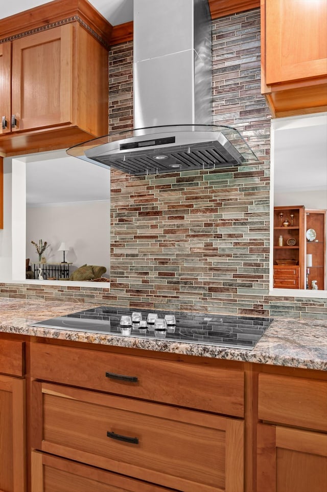 204 Chapman Ct, La Fayette, GA 30728 - kitchen featuring wall chimney range hood, decorative backsplash, black electric stovetop, and light stone counters
