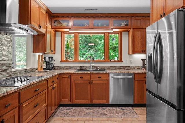 204 Chapman Ct, La Fayette, GA 30728 - kitchen featuring stainless steel appliances, a sink, wall chimney exhaust hood, brown cabinets, and light stone counters