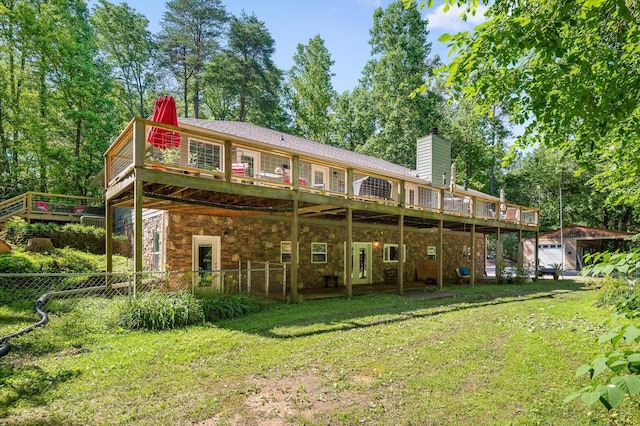 204 Chapman Ct, La Fayette, GA 30728 - back of property featuring an outdoor structure, a chimney, a wooden deck, and stone siding
