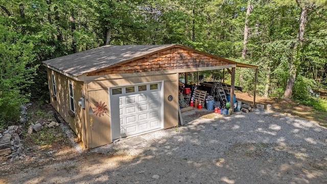 204 Chapman Ct, La Fayette, GA 30728 - garage featuring a garage and a view of trees