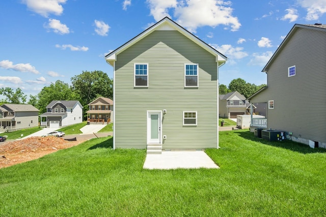 1441 Isaiah Dr, Clarksville, TN 37042 - rear view of house featuring entry steps, a lawn, central air condition unit, and a patio area