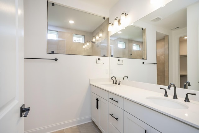 2370 Williamsport Lndg, Columbia, TN 38401 - bathroom with double vanity, a walk in shower, baseboards, and tile patterned floors