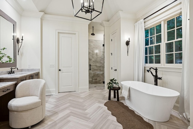 1616 Championship Blvd, Franklin, TN 37064 - full bath featuring a stall shower, a freestanding tub, vanity, a chandelier, and baseboards