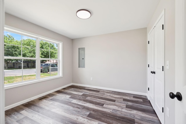304 S Maple St, Hohenwald, TN 38462 - unfurnished bedroom featuring electric panel, baseboards, wood finished floors, and a closet