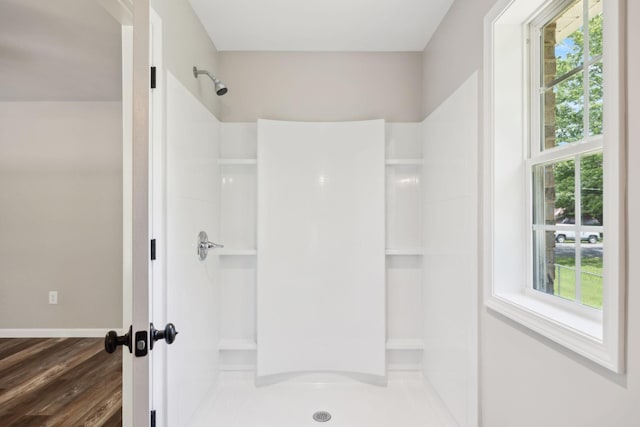 304 S Maple St, Hohenwald, TN 38462 - full bath featuring a shower, wood finished floors, and baseboards