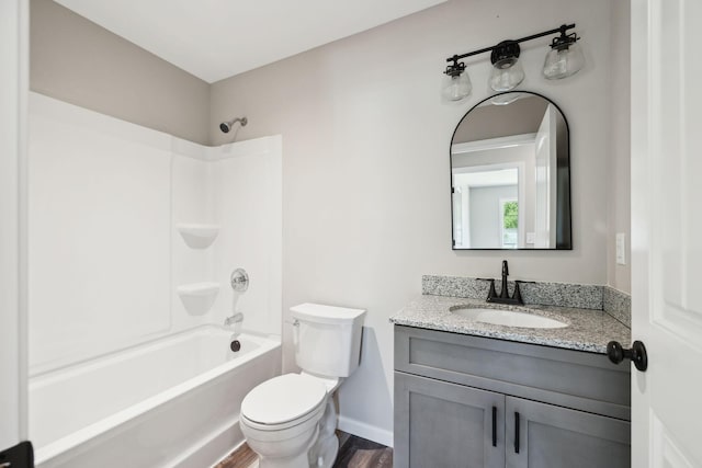 304 S Maple St, Hohenwald, TN 38462 - full bath featuring toilet, vanity, shower / bathtub combination, wood finished floors, and baseboards