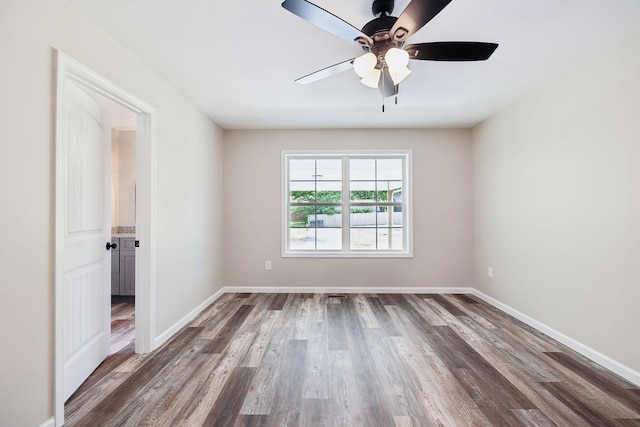 304 S Maple St, Hohenwald, TN 38462 - unfurnished room featuring wood finished floors, a ceiling fan, and baseboards