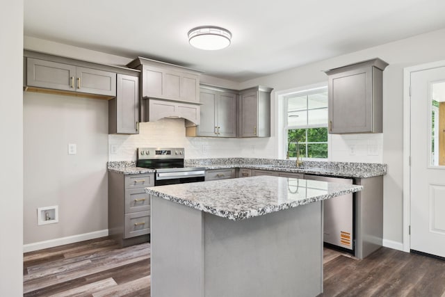 304 S Maple St, Hohenwald, TN 38462 - kitchen with appliances with stainless steel finishes, gray cabinetry, a sink, and tasteful backsplash