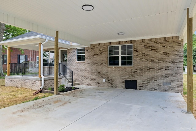 304 S Maple St, Hohenwald, TN 38462 - porch featuring an attached carport
