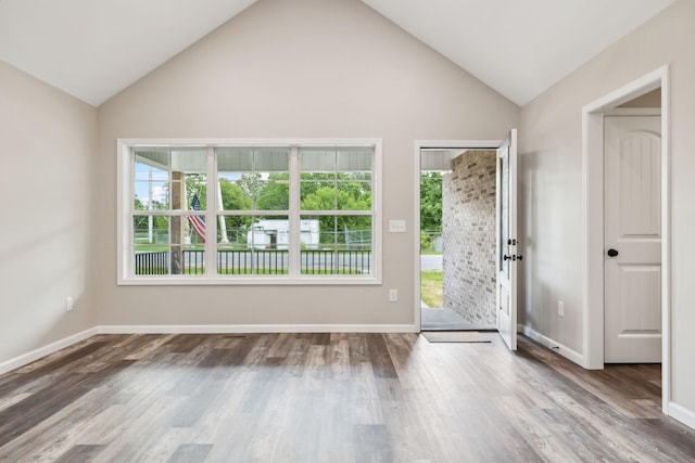 304 S Maple St, Hohenwald, TN 38462 - entryway with plenty of natural light, wood finished floors, baseboards, and high vaulted ceiling
