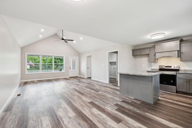 304 S Maple St, Hohenwald, TN 38462 - kitchen featuring stainless steel electric range oven, gray cabinets, open floor plan, custom range hood, and dark wood-type flooring