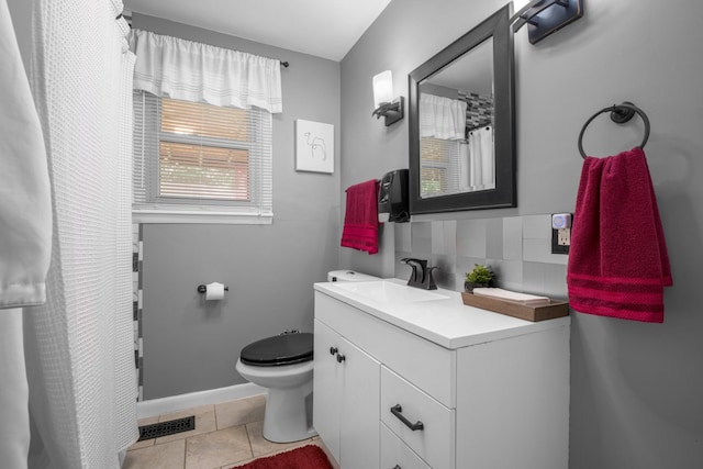708 Tumbleweed Trl, Mount Juliet, TN 37122 - bathroom featuring vanity, toilet, tile patterned floors, tasteful backsplash, and baseboards