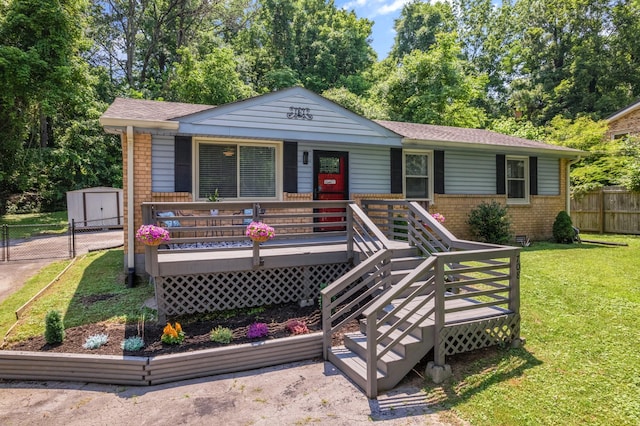 708 Tumbleweed Trl, Mount Juliet, TN 37122 - view of front facade featuring brick siding, covered porch, a shingled roof, and a storage unit