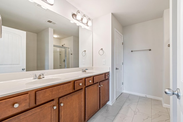 913 Battleview Pl, Murfreesboro, TN 37128 - bathroom featuring marble look tile flooring, double vanity, a shower stall, and baseboards