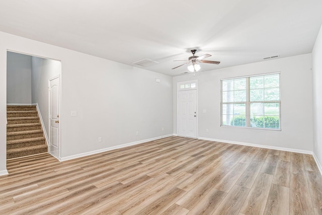913 Battleview Pl, Murfreesboro, TN 37128 - unfurnished living room featuring ceiling fan, light wood-type flooring, stairs, and baseboards