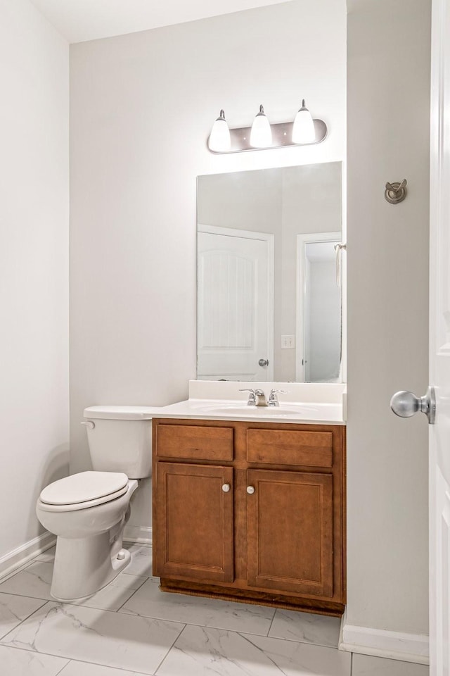 913 Battleview Pl, Murfreesboro, TN 37128 - bathroom featuring marble finish flooring, vanity, toilet, and baseboards