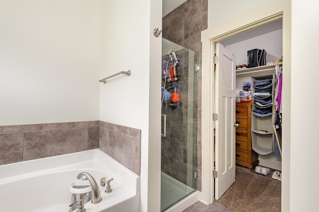 201 Hart Ln, Lebanon, TN 37087 - bathroom featuring a stall shower, a walk in closet, and a garden tub