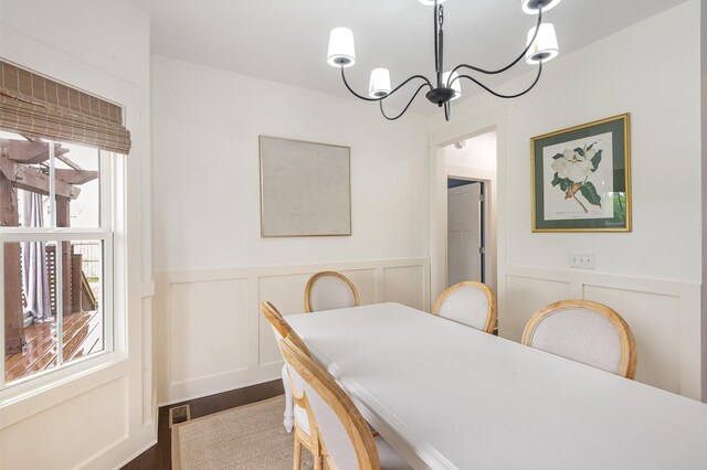 201 Hart Ln, Lebanon, TN 37087 - dining space with a decorative wall, a chandelier, dark wood finished floors, and wainscoting