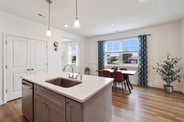 425 Multrees Pl, Smyrna, TN 37167 - kitchen with a sink, light wood-type flooring, gray cabinets, pendant lighting, and an island with sink