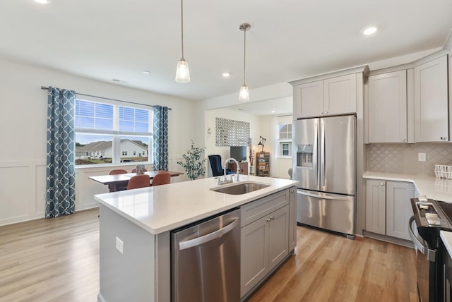 425 Multrees Pl, Smyrna, TN 37167 - kitchen featuring appliances with stainless steel finishes, gray cabinets, a sink, light wood-style flooring, and recessed lighting
