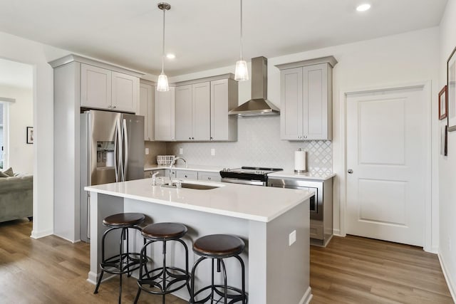 425 Multrees Pl, Smyrna, TN 37167 - kitchen with wall chimney exhaust hood, a sink, gray cabinets, appliances with stainless steel finishes, and recessed lighting