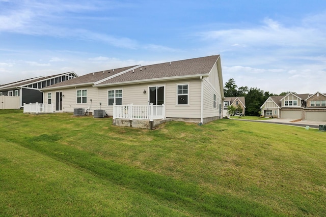 425 Multrees Pl, Smyrna, TN 37167 - rear view of house with central air condition unit, a lawn, and roof with shingles