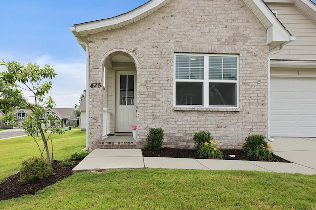 425 Multrees Pl, Smyrna, TN 37167 - view of front facade featuring an attached garage, a front yard, brick siding, and concrete driveway