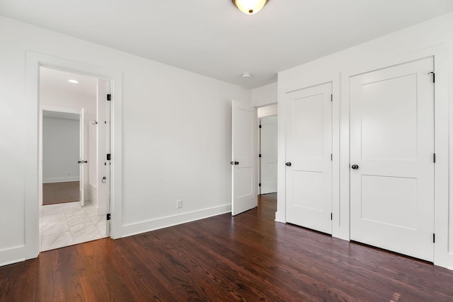 1508 Barnes Dr, Cookeville, TN 38501 - unfurnished bedroom with wood finished floors, baseboards, and ensuite bathroom
