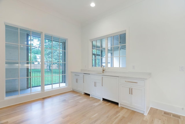 609 Bowling Ave, Nashville, TN 37215 - doorway with a sink, light wood-type flooring, baseboards, and recessed lighting