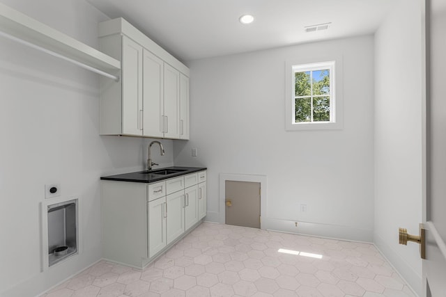 609 Bowling Ave, Nashville, TN 37215 - laundry room with cabinet space, electric dryer hookup, recessed lighting, and baseboards