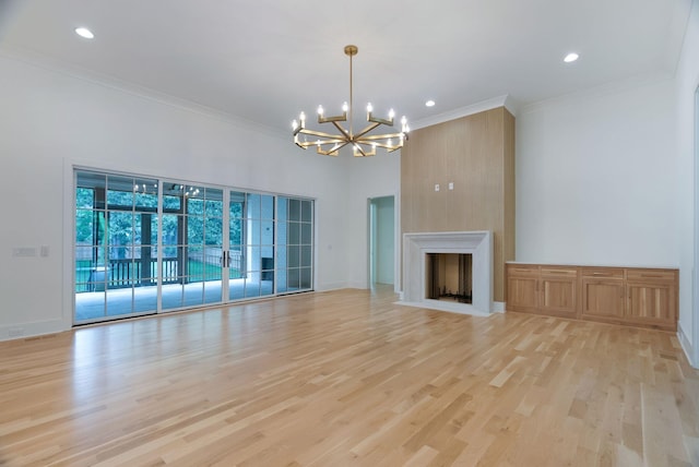 609 Bowling Ave, Nashville, TN 37215 - unfurnished living room featuring a chandelier, ornamental molding, light wood finished floors, recessed lighting, and a fireplace with flush hearth