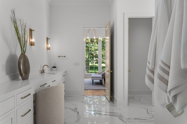 609 Bowling Ave, Nashville, TN 37215 - bathroom featuring marble finish flooring, baseboards, and vanity