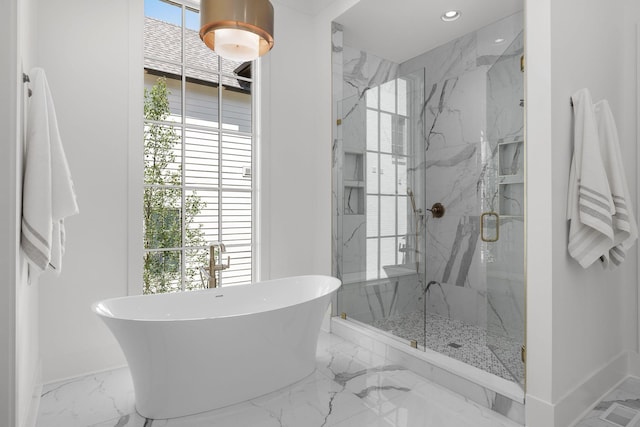 609 Bowling Ave, Nashville, TN 37215 - bathroom with marble tiled floors, a soaking tub, a marble finish shower, baseboards, and recessed lighting