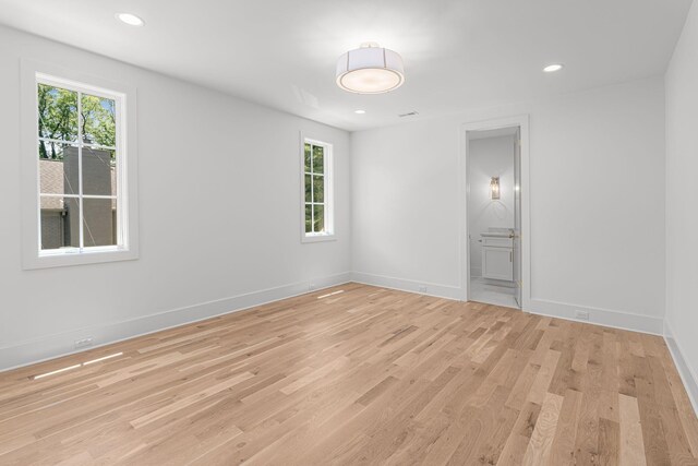 609 Bowling Ave, Nashville, TN 37215 - spare room with healthy amount of natural light, light wood-style floors, baseboards, and recessed lighting
