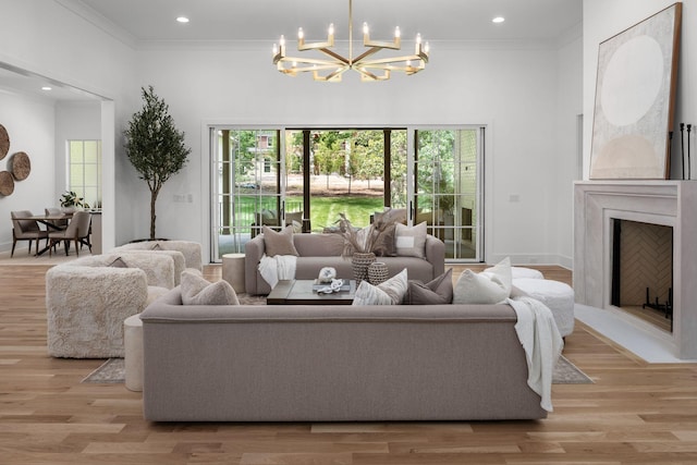 609 Bowling Ave, Nashville, TN 37215 - living room featuring a chandelier, ornamental molding, light wood finished floors, recessed lighting, and baseboards