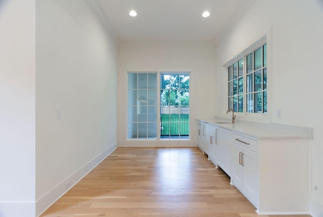 609 Bowling Ave, Nashville, TN 37215 - bar with a sink, light wood-style floors, recessed lighting, and baseboards