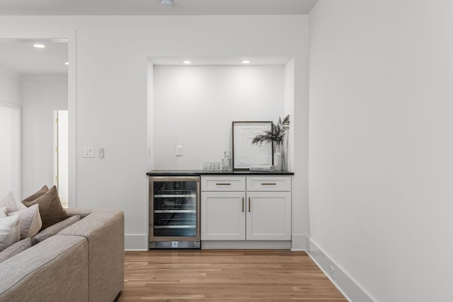 609 Bowling Ave, Nashville, TN 37215 - indoor wet bar featuring wine cooler, light wood-style floors, recessed lighting, and baseboards