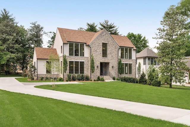 609 Bowling Ave, Nashville, TN 37215 - modern home featuring a front lawn, stone siding, and a shingled roof
