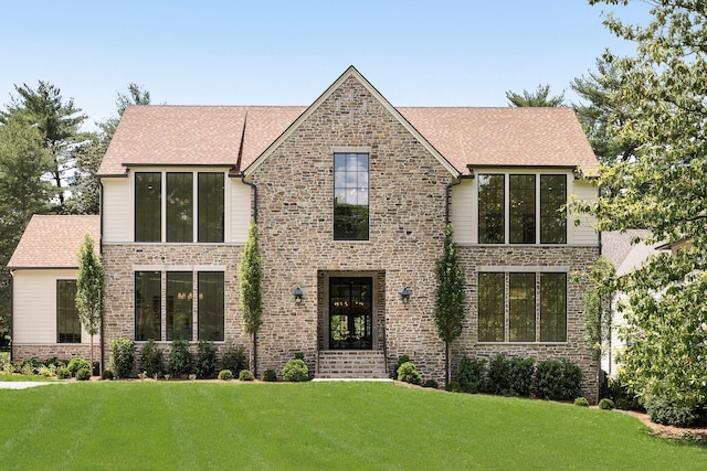 609 Bowling Ave, Nashville, TN 37215 - view of front of property with a front lawn, stone siding, and a shingled roof