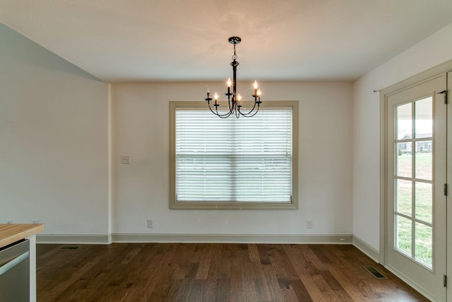 1146 Garrettsburg Rd, Clarksville, TN 37042 - unfurnished dining area featuring a chandelier, dark wood-type flooring, and baseboards
