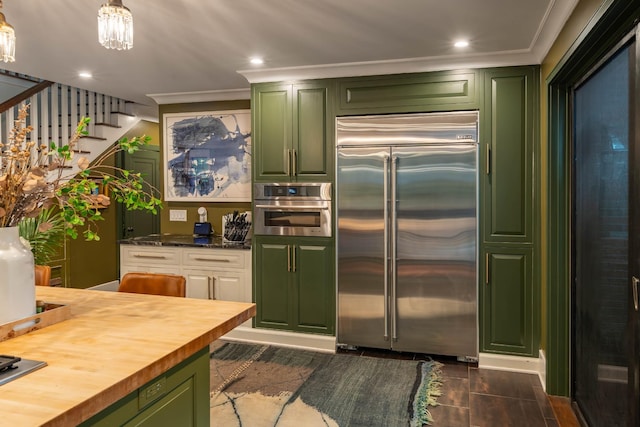 1702 Stokes Ln, Nashville, TN 37215 - kitchen featuring stainless steel appliances, green cabinets, wooden counters, crown molding, and recessed lighting