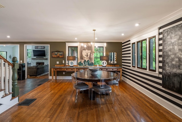 1702 Stokes Ln, Nashville, TN 37215 - dining area with stairs, ornamental molding, a fireplace, wood finished floors, and healthy amount of natural light