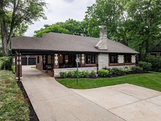 1702 Stokes Ln, Nashville, TN 37215 - view of front of house featuring a front lawn, roof with shingles, driveway, and a chimney