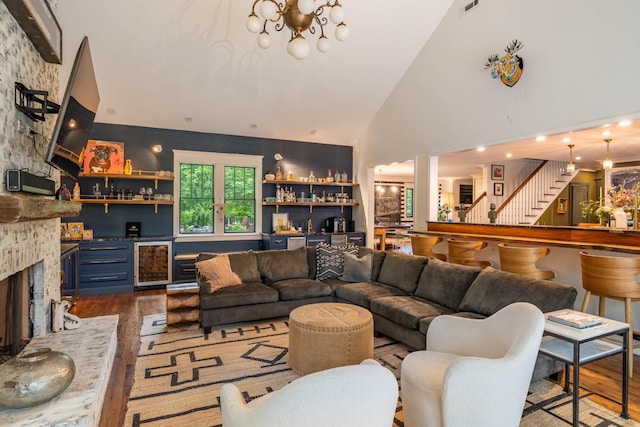 1702 Stokes Ln, Nashville, TN 37215 - living area with dark wood-type flooring, wine cooler, bar area, a chandelier, and high vaulted ceiling